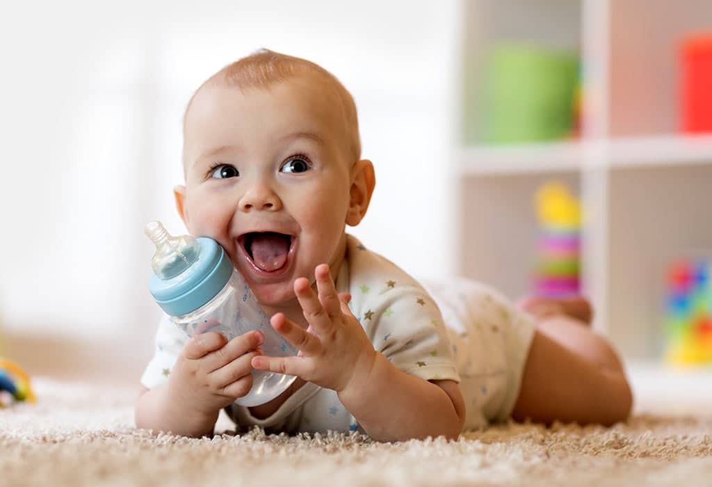 Baby Playing With Bottle Instead Of Drinking