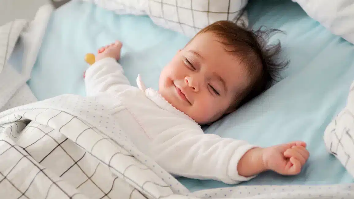 Understanding Why Babies Sleep with Arms Up